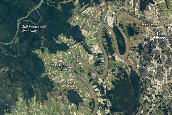 High-resolution NASA International Space Station photograph of the Mississippi River meandering through Baton Rouge, Louisiana, captured from orbit in October 2024.